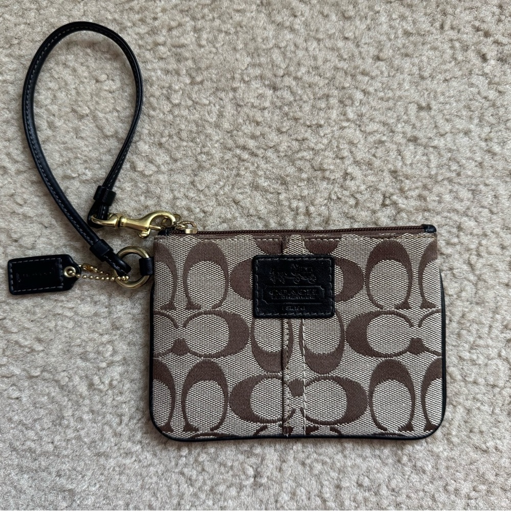 Brown and Tan Wristlet with Logo Pattern